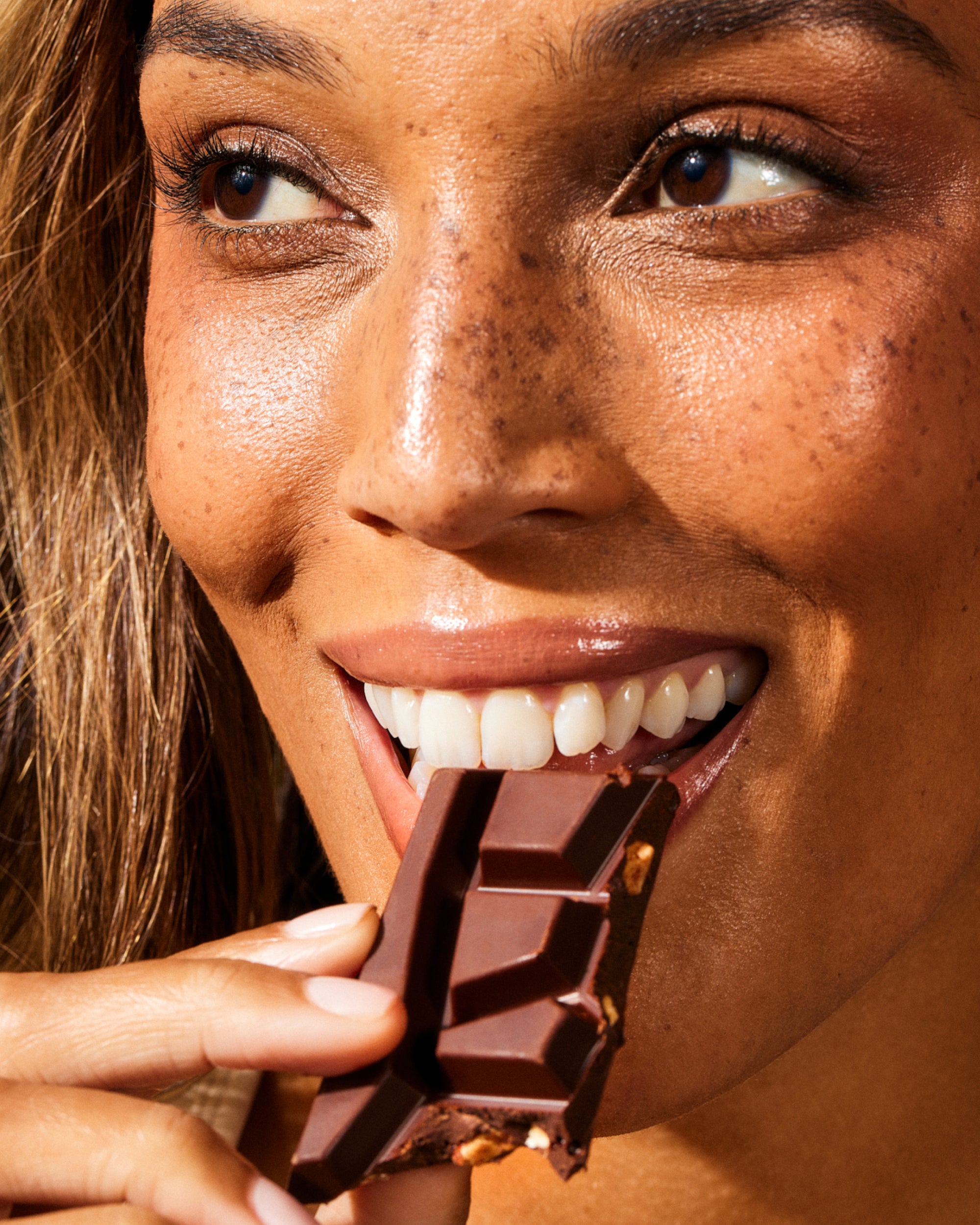 Shroom Bloom supplement - radiant smile with a chocolate treat - energizes and nourishes from within.