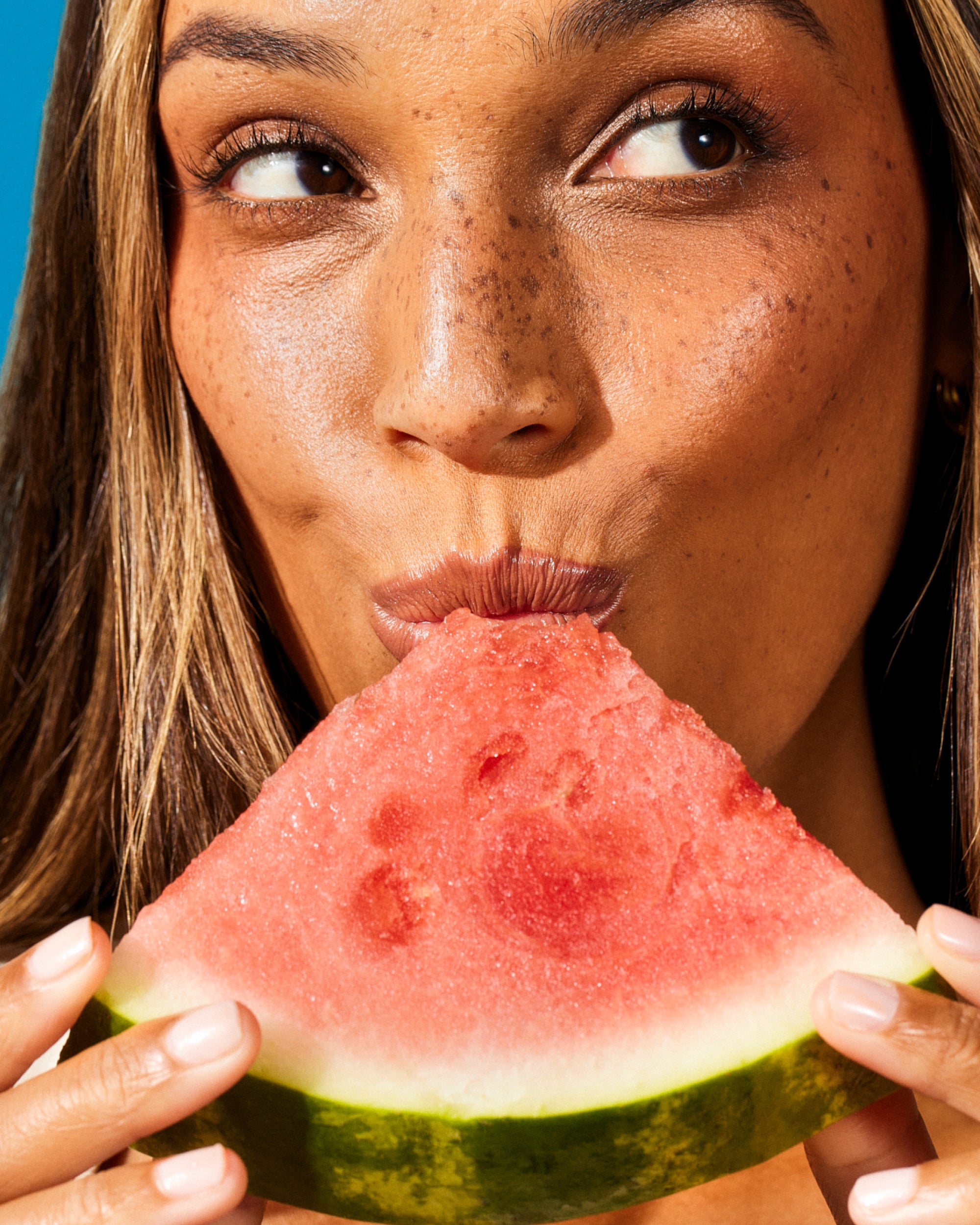 Super Human supplement by Sunny Within - lips tasting a radiant watermelon - energizes and nourishes your body.
