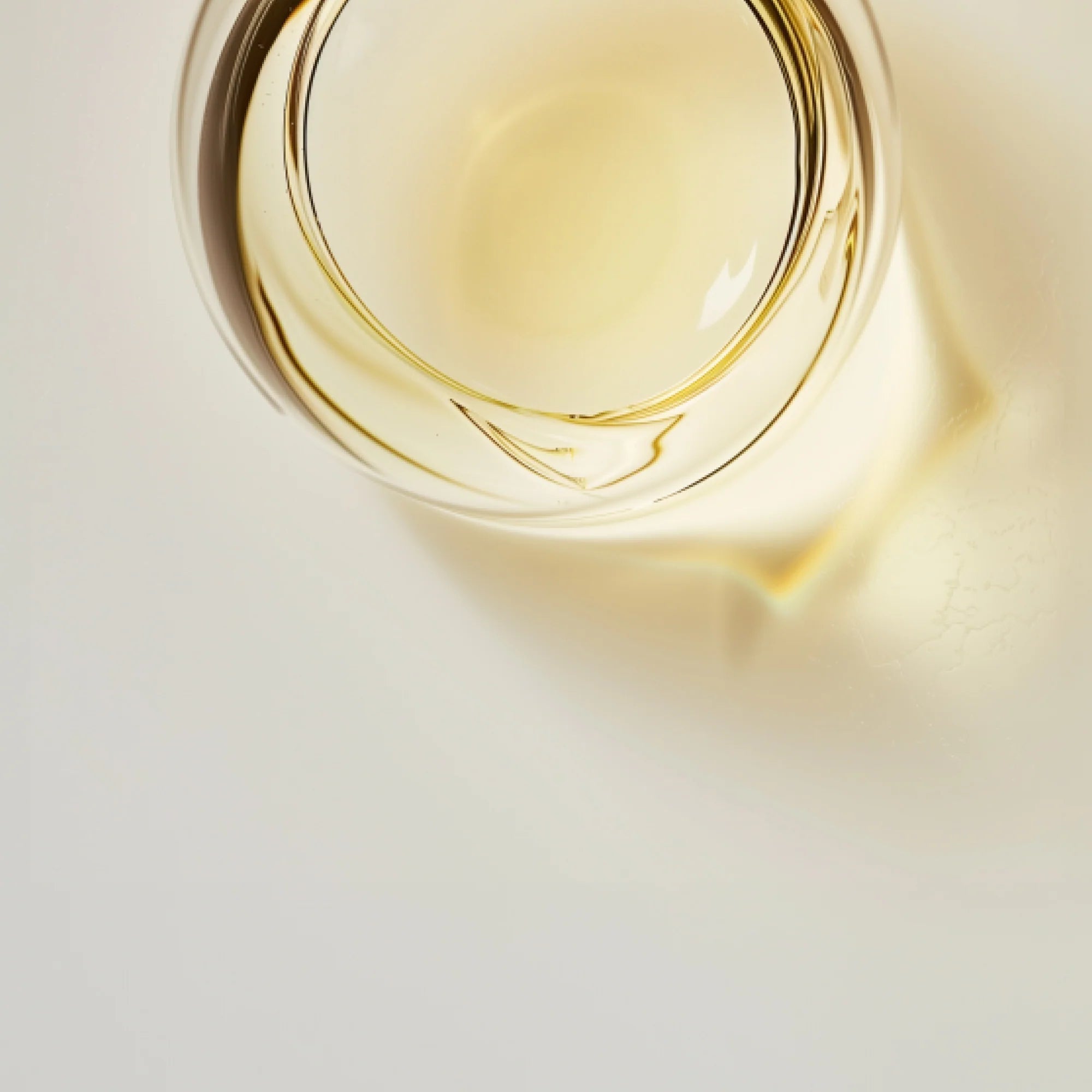 SuperHuman NAD supplement by Sunny Within - golden, energizing liposomal liquid in a glass bottle.