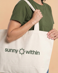 Sunny Within tote bag filled with liposomal supplements - energize and nourish your body for a radiant glow.